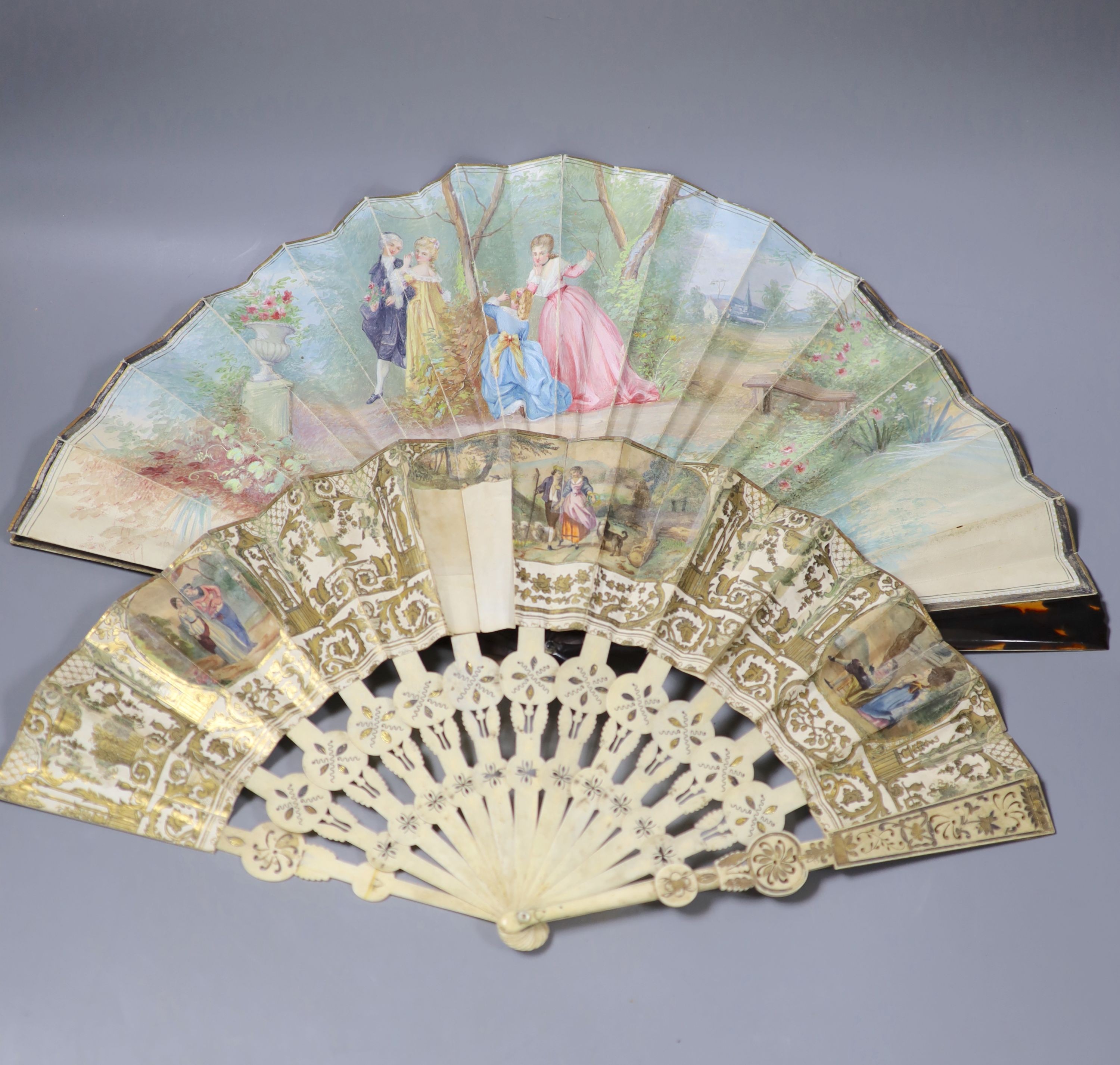 A late 19th century French painted vellum and tortoishell fan, 29.5cm and another